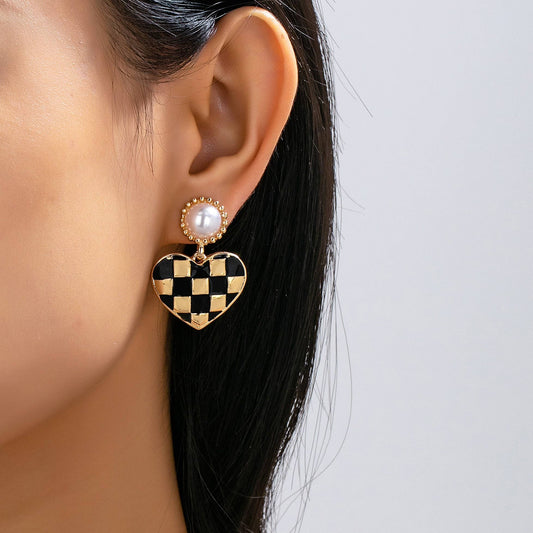 vintage styled black and gold checkered heart drop earrings with faux pearl