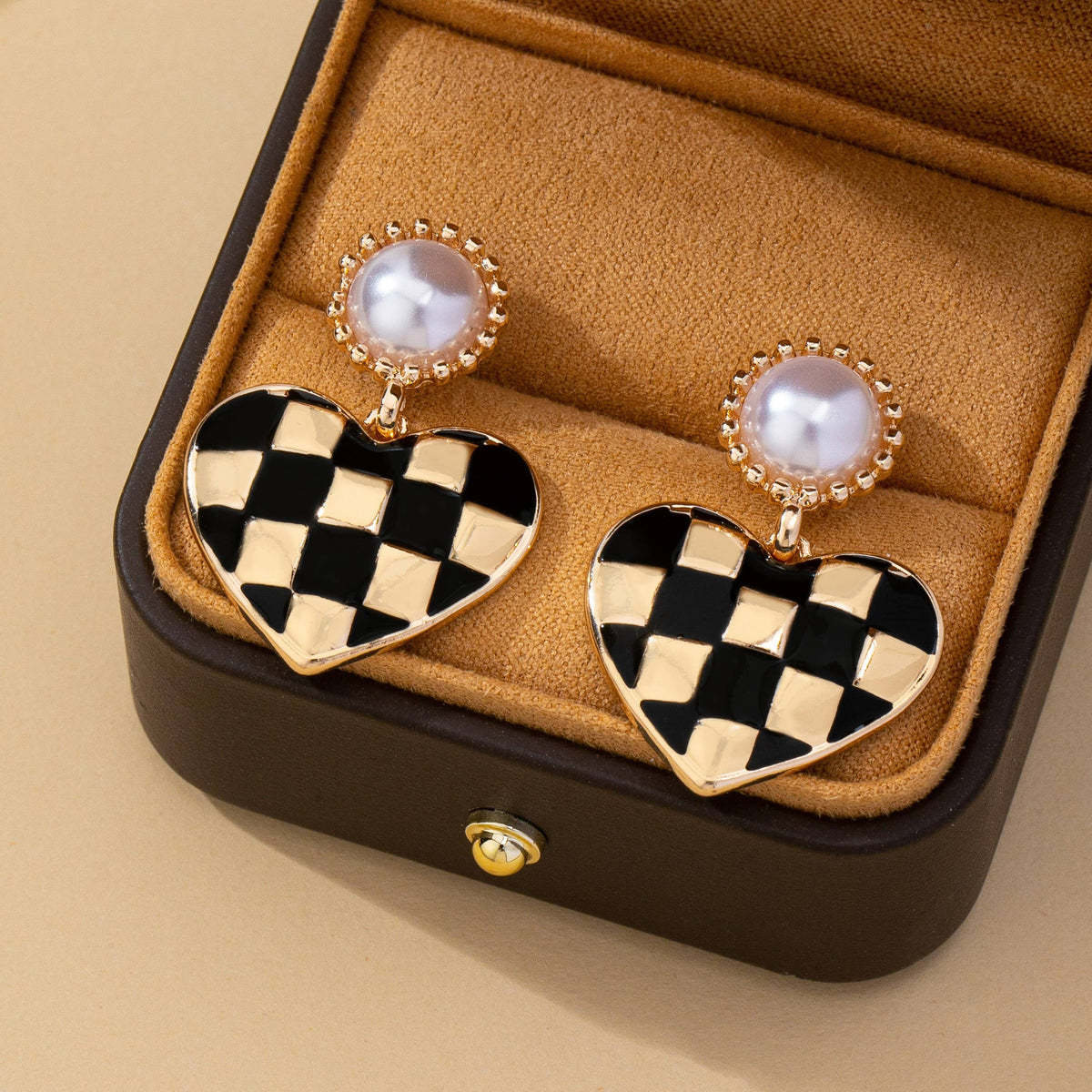 vintage styled black and gold checkered heart drop earrings with faux pearl