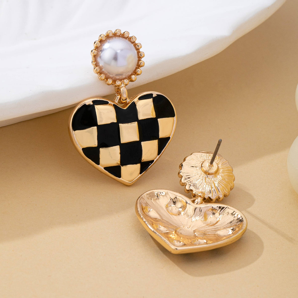 vintage styled black and gold checkered heart drop earrings with faux pearl