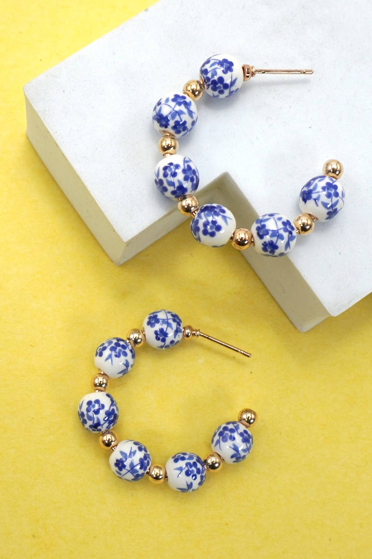 Hoop earrings with white and blue toile patterned beads