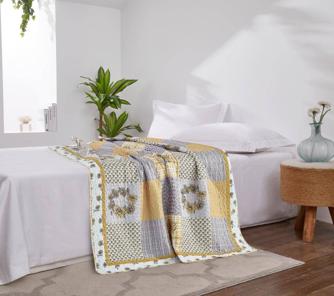 patchwork gray and yellow sunflower quilt