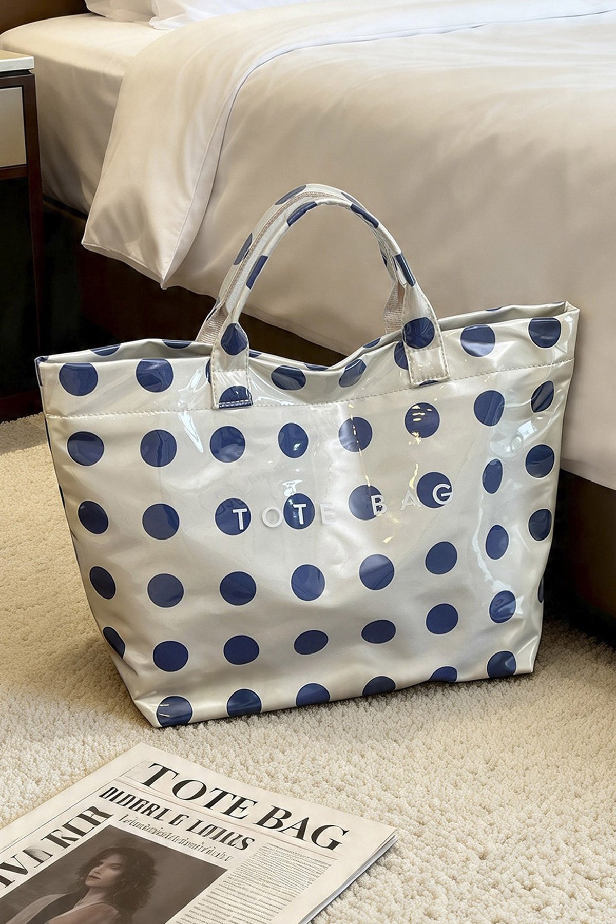 Glossy Waterproof gray tote bag with blue polka dots with the word "tote bag" across the front