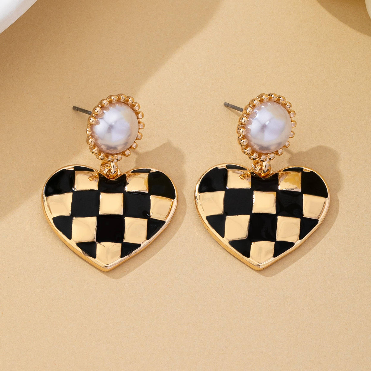 vintage styled black and gold checkered heart drop earrings with faux pearl