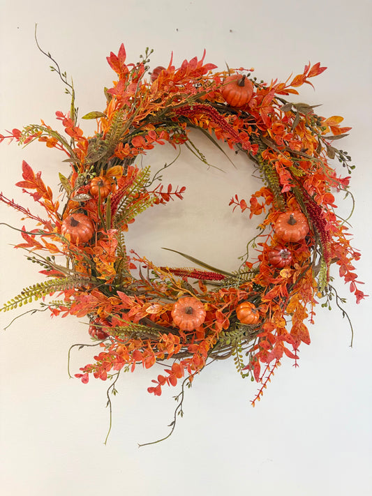 18" round wreath with orange fall foliage and orange pumpkins