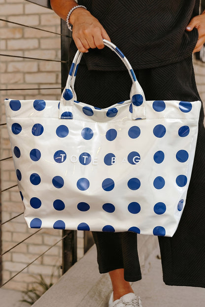 Glossy Waterproof gray tote bag with blue polka dots with the word "tote bag" across the front