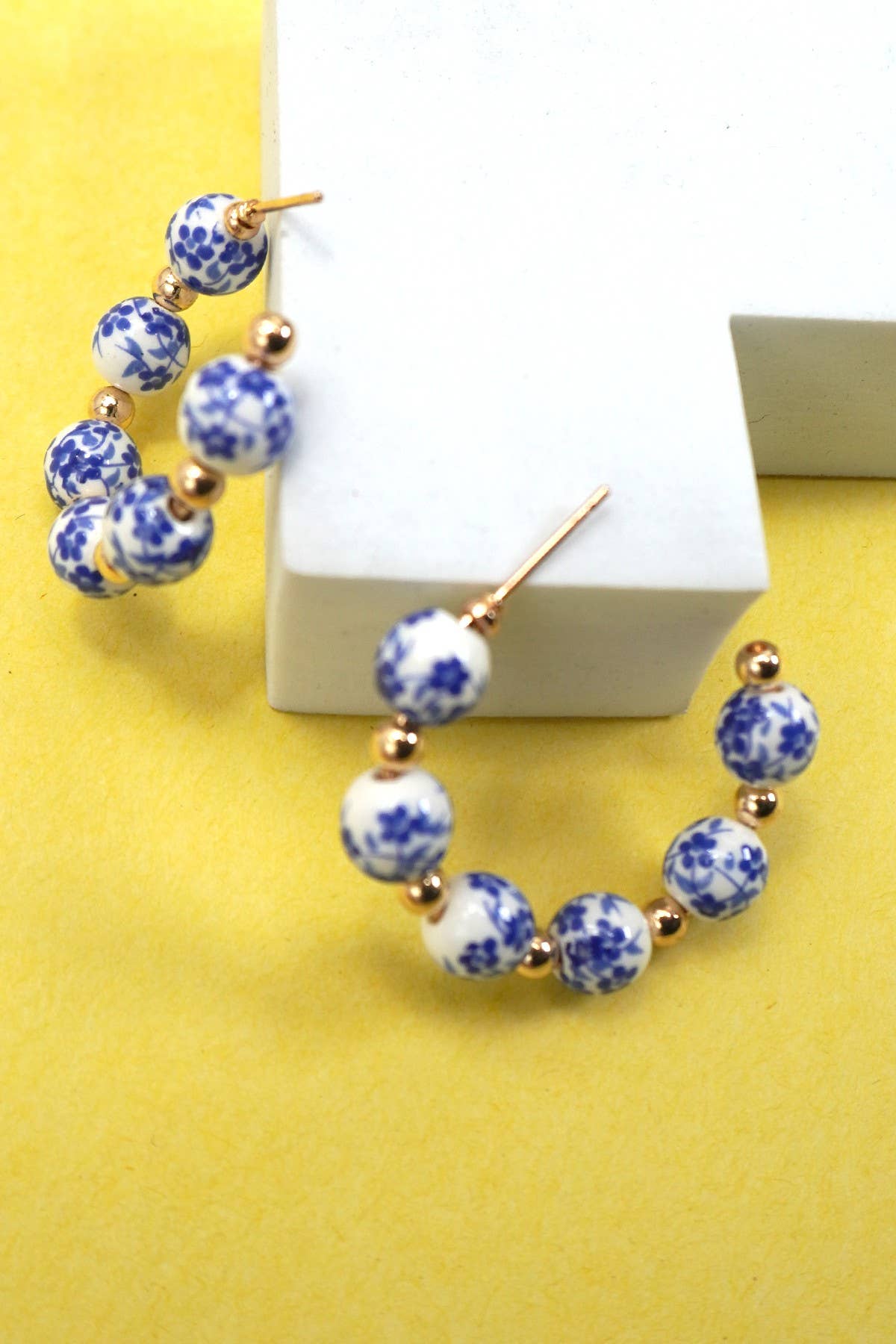 Hoop earrings with white and blue toile patterned beads