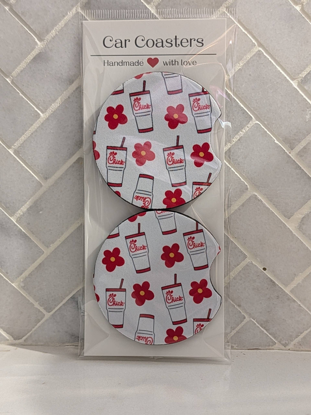 white car coasters with chick-fil-a cups and red flowers