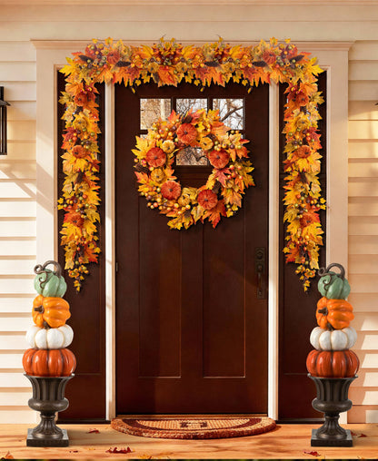 Stack of orange, white, and turquoise pumpkins on an urn for front porch