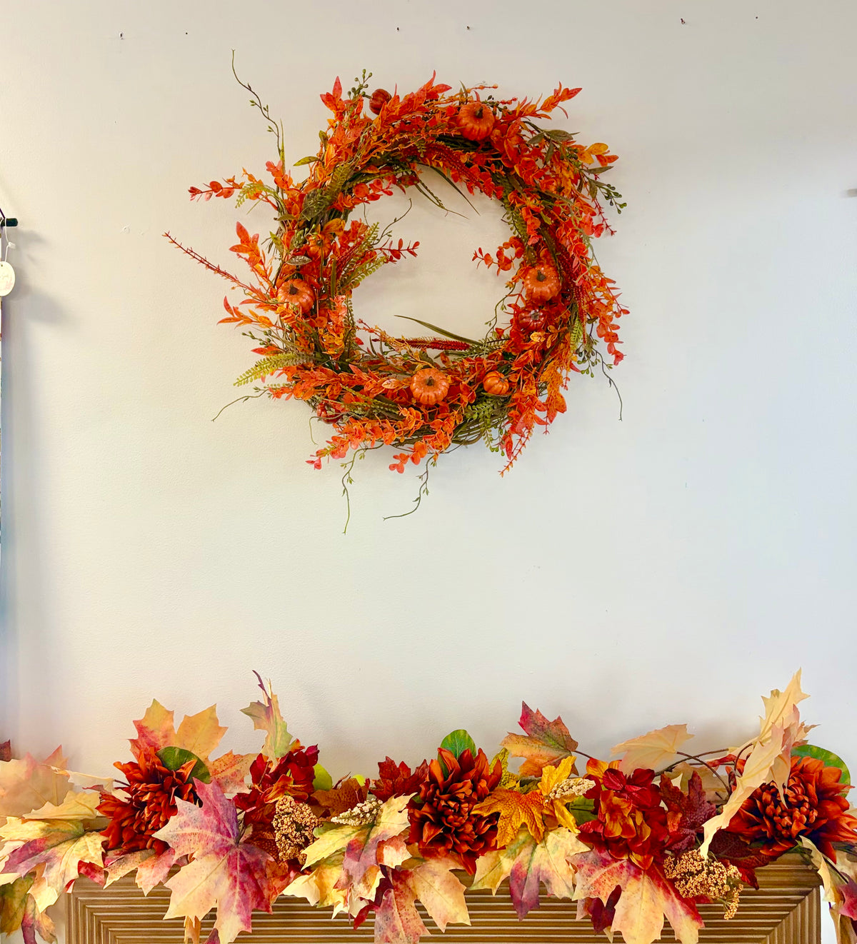 18" round wreath with orange fall foliage and orange pumpkins