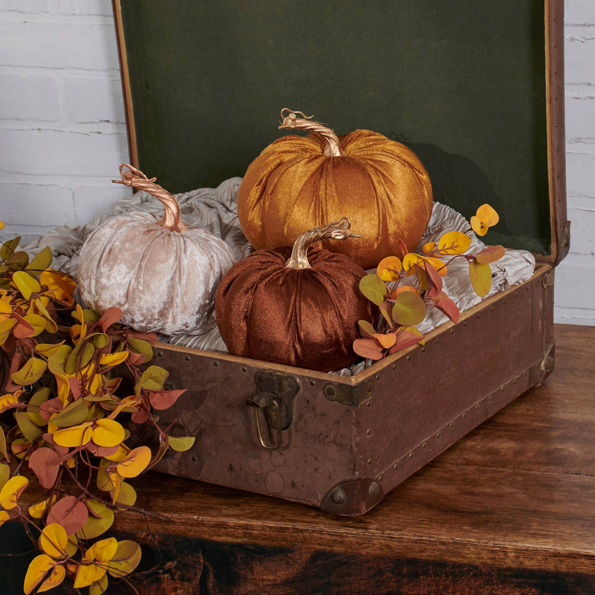 Set of orange, brown, and cream velvet pumpkins with gold stems